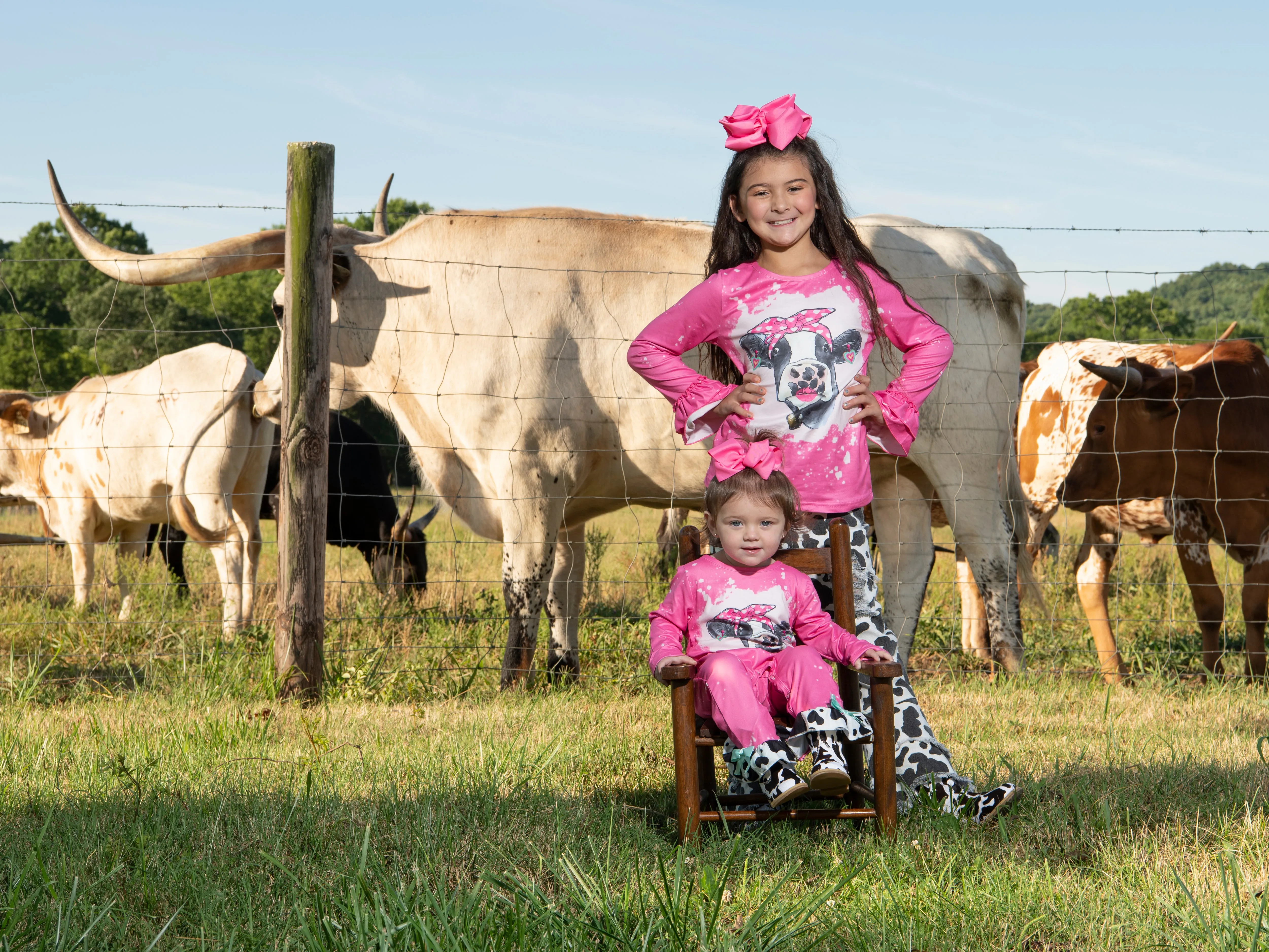 Pink Bleached Cow Top & Distressed Pants Outfit