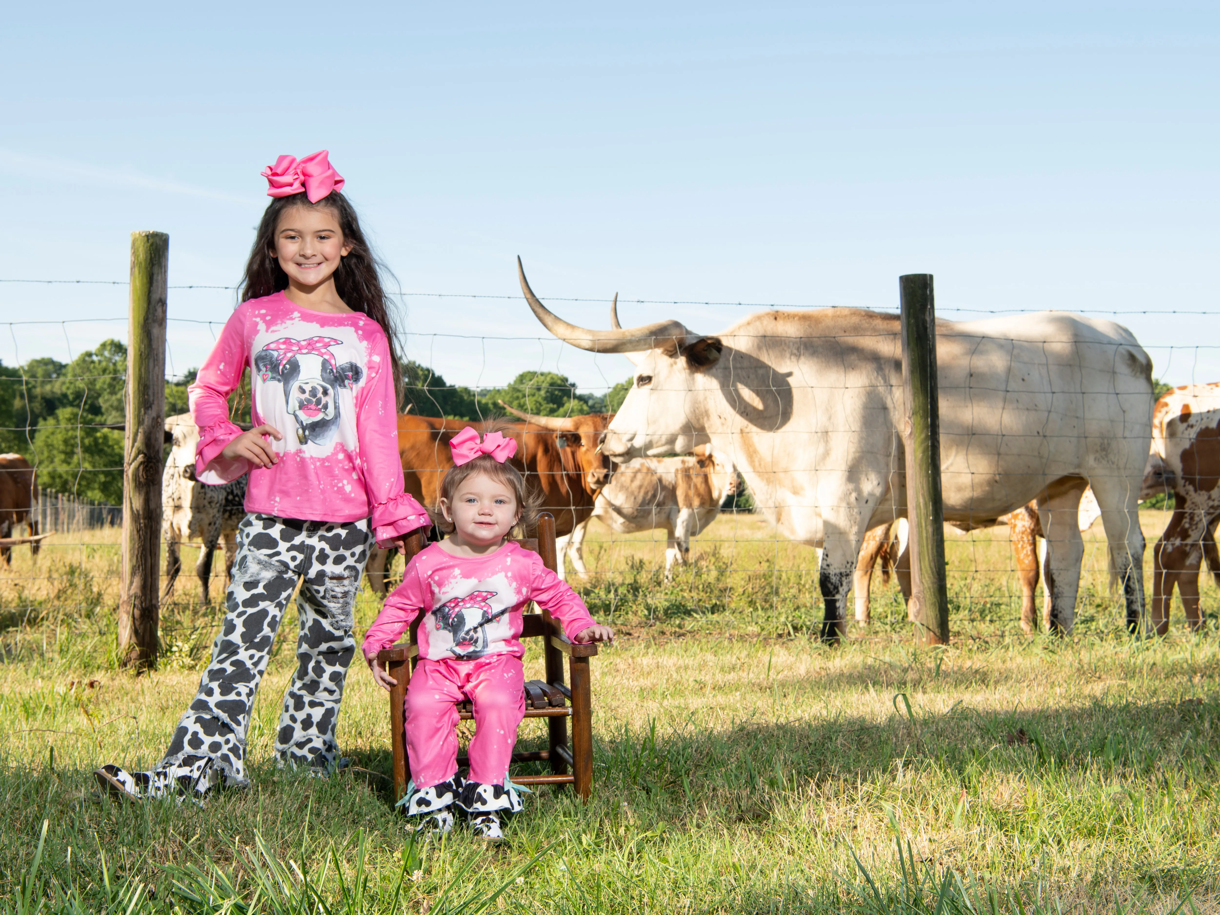 Pink Bleached Cow Top & Distressed Pants Outfit