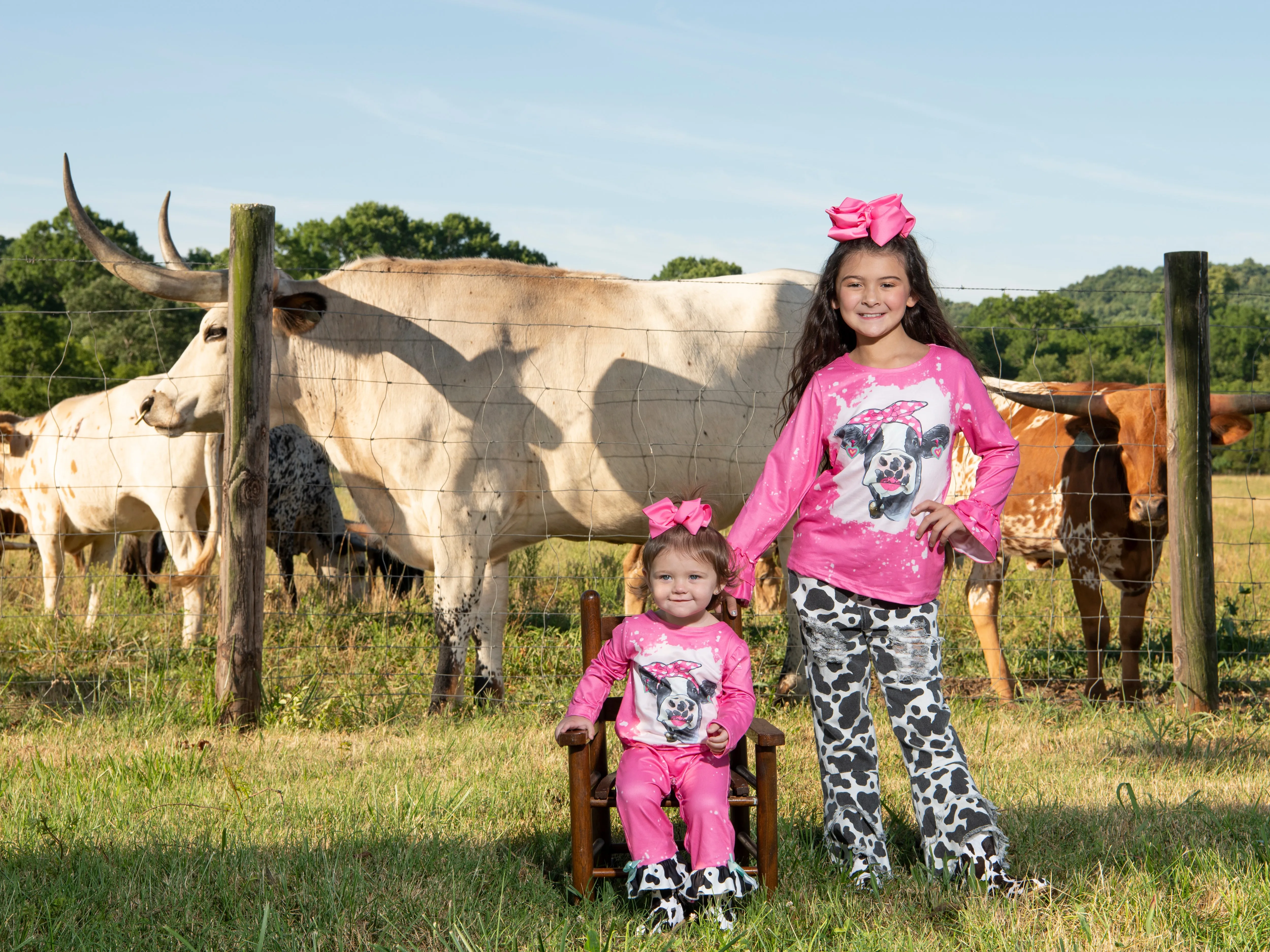 Pink Bleached Cow Top & Distressed Pants Outfit